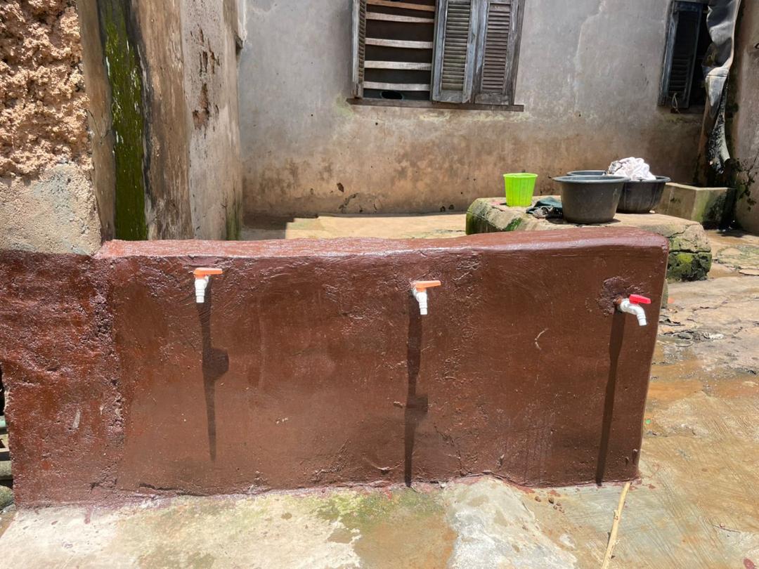 Completed tap stand with three taps, freshly painted