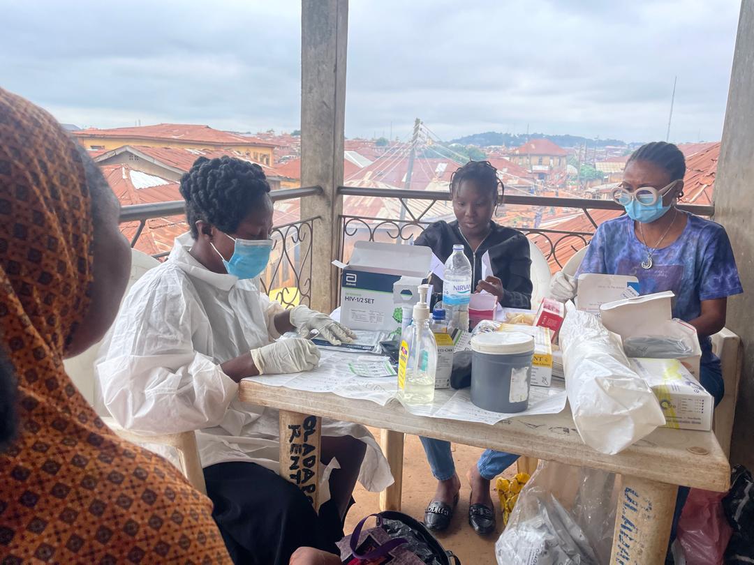 Foundation medical staff at the blood screening table, patient identity kept private