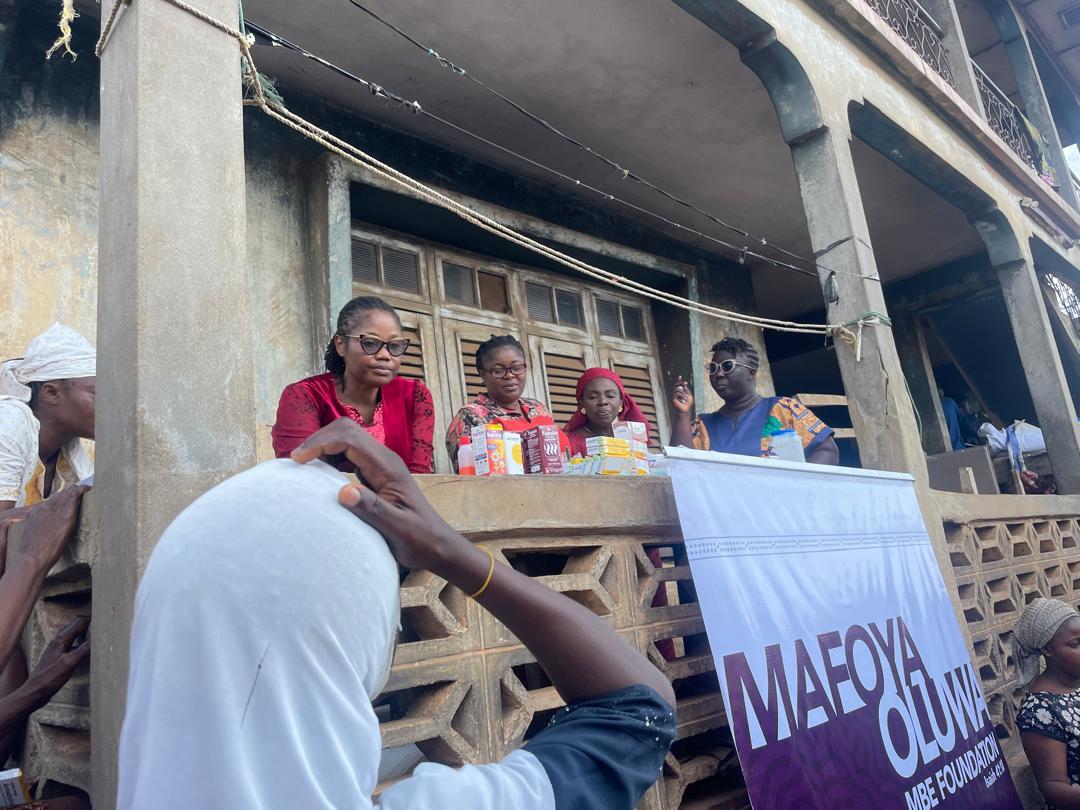 The foundation's medical team at the supply table with the Mafoya Oluwa banner